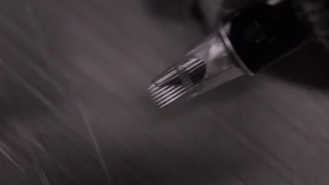 Tattoo machine in super macro super slowmotion Stock Footage 129321029