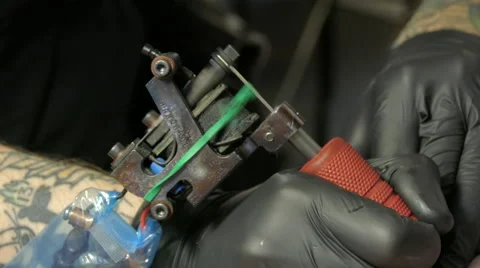 Tattoo machine at work, artist, 4k Stock Footage 63302814