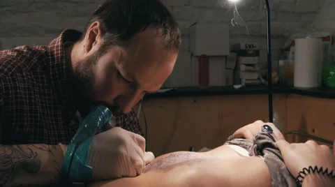 Tattoo master with beard making a tattoo of mandala pattern. Close up shot Stock Footage 67520813