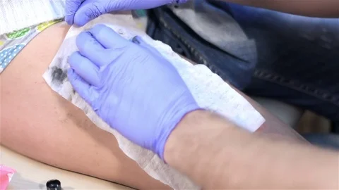 Tattoo master in blue gloves. Close up Stock Footage 70728798