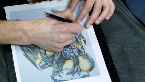 Tattoo master draw picture Stock Footage 88377974