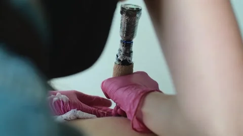 Tattoo master hands work at tattoo salon. Professional tattooist creating Stock Footage 250794796