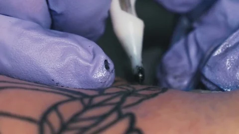 Tattoo master makes the tattoo close-up Stock Footage 73140251