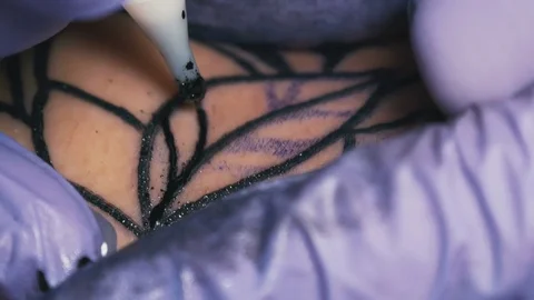 Tattoo master makes the tattoo close-up Stock Footage 73141198