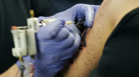 Tattoo Master Makes Tattoo On The Human Body 1 Stock Footage 61353370
