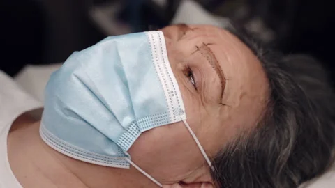 Tattoo master making permanent eyebrows tattoo with color pigment, beauty salon Stock Footage 164051642