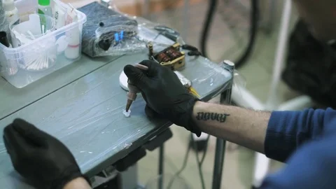 Tattoo master prepare his instruments to work. Hygiene sterile and clean Stock Footage 76044281