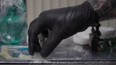 Tattoo master prepare his instruments to work. Hygiene sterile and clean equipme Stock Footage 87755383