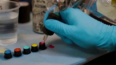 Tattoo needle diping into ink Stock Footage 62422537