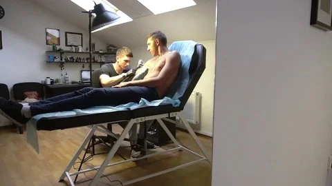 Tattoo parlor professional master almost finished work on tattooing Stock Footage 82840397