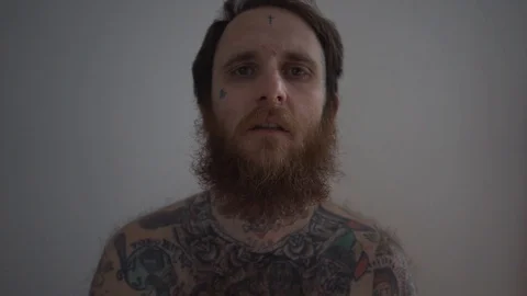Tattooed crazy man scream desolation Stock Footage 89802666