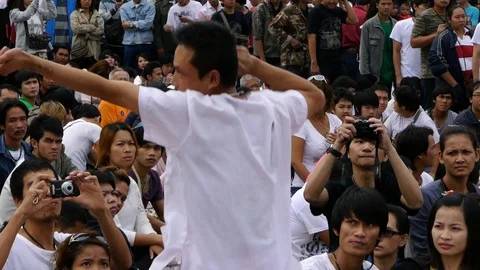 A tattooed devotee at Wat Bang Phra possessed by the spirits. Video stock 121073967
