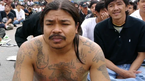 Tattooed devotees at Wat Bang Phra, Thailand. Stock Footage 121073625