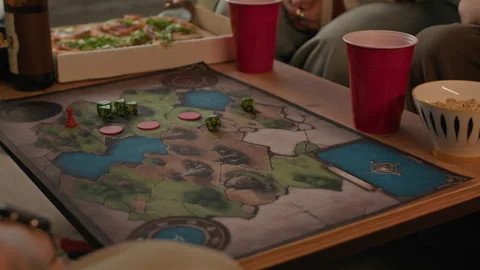 Tattooed Guy Rolling Dice while Playing Tabletop Game with Friends Stock Footage 294342739