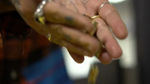 Tattooed Hands Dropping Gun Shells Vídeos de archivo 87454461