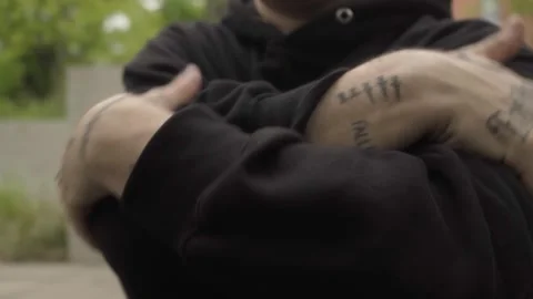 Tattooed hands move expressively over the dancer's body showing the street style Stock Footage 283489644