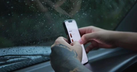 Tattooed Hands Using Smartphone Inside Car During Rain... Stock Footage 332075392