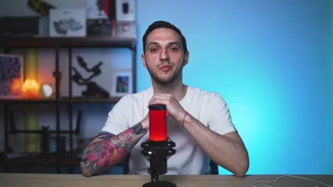 Tattooed Host Talking in Professional Podcast Studio Environment Stock Footage 310359199