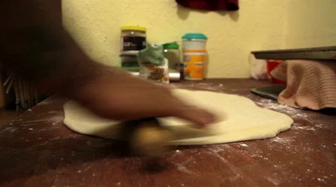 Tattooed man hands preparing pizza dough with a roller. Stock Footage 50415522