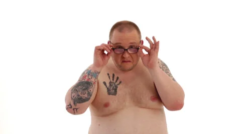 Tattooed man styles himself 1 Stock Footage 24631836