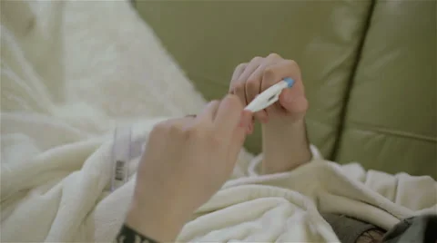 A tattooed man taking his temperature. Close up Stock Footage 61931479