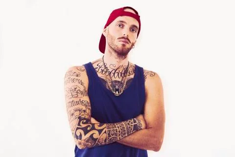Tattooed rap singer posing in studio on a white background Foto stock