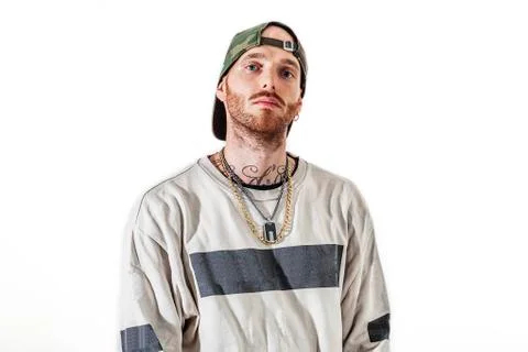Tattooed rap singer posing in studio on a white background Foto stock
