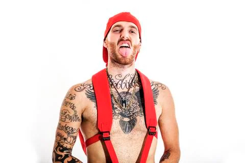 Tattooed rap singer posing in studio on a white background Foto stock