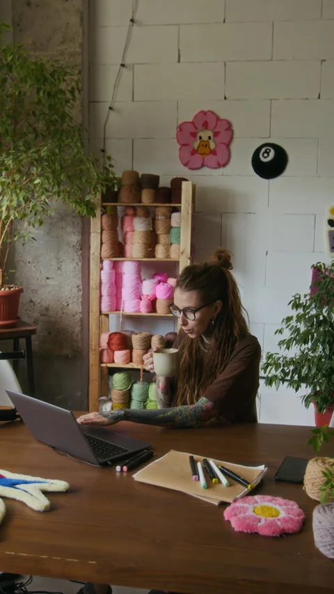 Tattooed Woman in Studio using Computer Vertical Stock Footage 316492407