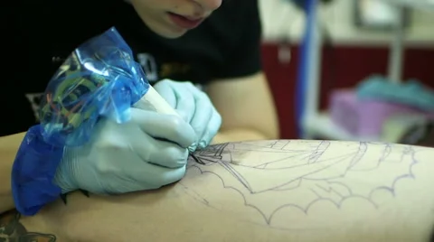 Tattooer Showing Process Of Making A Tattoo Stock-Footage 60848864