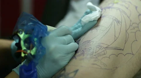 Tattooer Showing Process Of Making A Tattoo Video stock 60930000