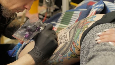 Tattooer at work in studio Stock Footage 88377718
