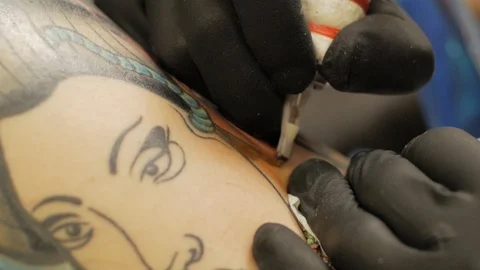 Tattooer at work in studio Stock Footage 88377788