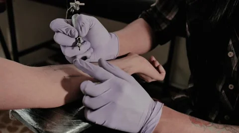 Tattooing arm Stock Footage 53046931