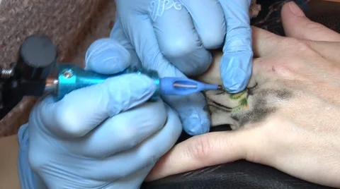 Tattooing close up Stockbeeldmateriaal 45327934