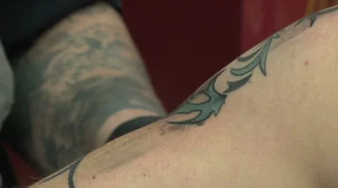 Tattooing - close up - upper left arm Video stock 10604935
