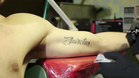 Tattooing (invictus - invincible) _1 Stock Footage 12735899