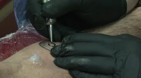 Tattooing lower right arm - close up Video stock 10604936