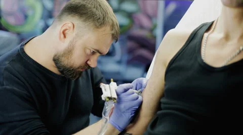 Tattooing Procedure in studio Stock Footage 61353209