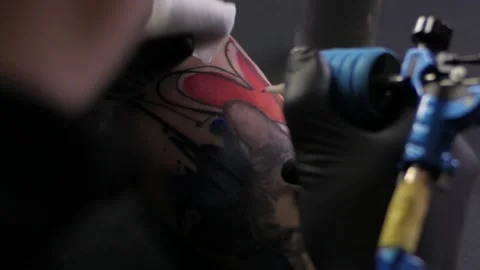 Tattooing process Transfer tattoo Close-up Tatto mashine Tatto studio Tatto  Stock Footage 225313760