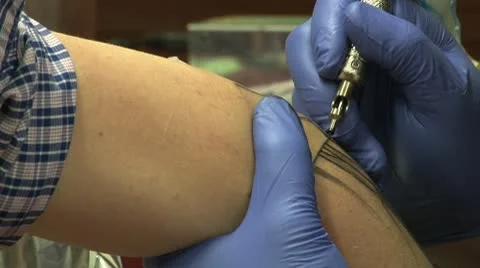 Tattooing spider web on elbow medium shot Video stock 10604914