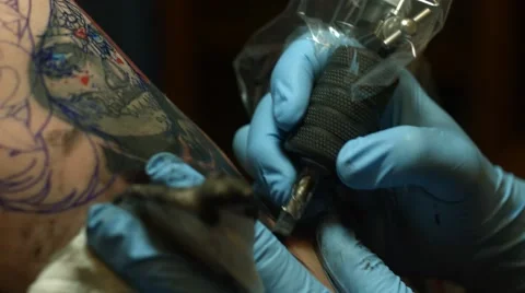 Tattooing Sugar Skull on Bicep Stock Footage 54477611