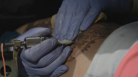 Tattooist making of tattoo Stock Footage 39557793