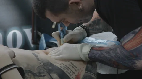Tattooist making of tattoo Stock Footage 39557869