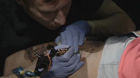 Tattooist making of tattoo Stock Footage 39558025