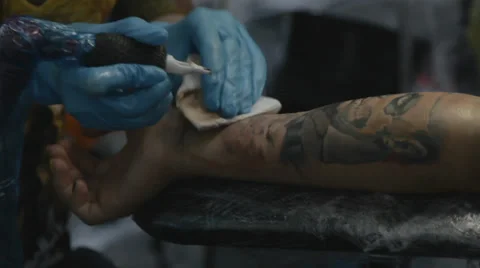 Tattooist making of tattoo Stock Footage 39558224