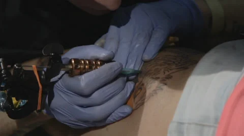 Tattooist making of tattoo Stock Footage 39558370