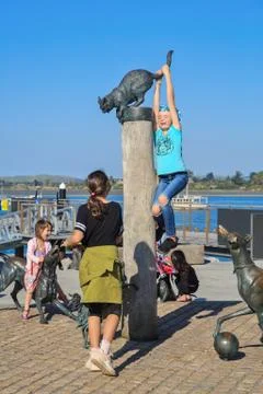 TAURANGA, NEW ZEALAND - 4/20/2019: Children play on waterfront sculptures Stock Photos