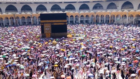 Tavaf with umbrellas Stock Footage 103059935