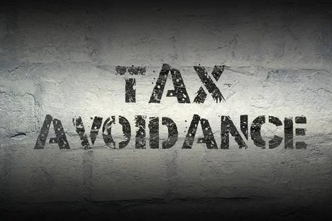 Tax avoidance gr tax avoidance stencil print on the grunge white brick wal... Stock Photos